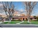 Charming single story brick home with meticulous landscaping and a paved walkway to the front door at 3104 Conners Dr, Las Vegas, NV 89107