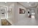 Bright hallway with art and view of the living room at 3104 Conners Dr, Las Vegas, NV 89107