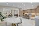 Open floor plan showing kitchen and dining area with modern appliances and ample seating at 3104 Conners Dr, Las Vegas, NV 89107