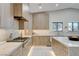 Modern kitchen features custom wood cabinets, marble countertops, and stainless steel appliances including range at 3104 Conners Dr, Las Vegas, NV 89107