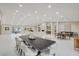 Expansive living room features modern lighting, fireplace, decor, and neutral tones at 3104 Conners Dr, Las Vegas, NV 89107