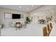 Spacious living room with modern seating, open floor plan, and large-screen TV, ideal for entertaining at 3104 Conners Dr, Las Vegas, NV 89107
