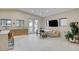 Bright living space with tile flooring, natural light, and access to the backyard at 3104 Conners Dr, Las Vegas, NV 89107