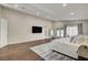 Spacious main bedroom with hardwood floors, sitting area, and walk-in closet; a serene retreat at 3104 Conners Dr, Las Vegas, NV 89107
