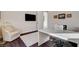 Home office features a desk, comfortable armchair, and tasteful artwork creating an ideal work environment at 3104 Conners Dr, Las Vegas, NV 89107
