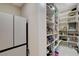 Walk-in pantry features ample shelving and storage space, adjacent to a stainless steel refrigerator at 3104 Conners Dr, Las Vegas, NV 89107