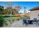 Relaxing patio with seating area and grassy lawn at 3104 Conners Dr, Las Vegas, NV 89107