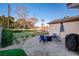 Cozy patio with fire pit and seating area at 3104 Conners Dr, Las Vegas, NV 89107