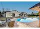 Relaxing pool and patio with brick pavers and seating at 3104 Conners Dr, Las Vegas, NV 89107