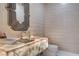 Stylish powder room featuring a unique vessel sink and decorative mirror at 3104 Conners Dr, Las Vegas, NV 89107