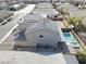 Aerial view of house with pool and solar panels at 3439 Midnight Shadows Way, North Las Vegas, NV 89032