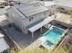 Two-story house with solar panels, pool, and patio at 3439 Midnight Shadows Way, North Las Vegas, NV 89032