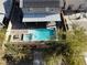 Aerial view of house with solar panels and pool at 3439 Midnight Shadows Way, North Las Vegas, NV 89032