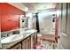 Bathroom with double sinks and a bathtub at 3439 Midnight Shadows Way, North Las Vegas, NV 89032