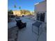 Backyard patio has a nice table and chairs near the gated swimming pool at 4466 Palm Grove Dr, Las Vegas, NV 89120