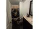 Well-lit bathroom with butterfly-themed decor and dark cabinets at 4466 Palm Grove Dr, Las Vegas, NV 89120
