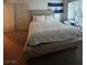 Bright bedroom features neutral tones, a king bed and an El Salvador flag at 4466 Palm Grove Dr, Las Vegas, NV 89120