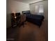 Bedroom with a workspace area bathed in natural light from the shuttered window at 4466 Palm Grove Dr, Las Vegas, NV 89120