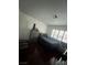 A compact bedroom featuring shuttered windows, offering natural light and a private space at 4466 Palm Grove Dr, Las Vegas, NV 89120
