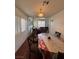 Dining room featuring wood floors, natural light and seating for six at 4466 Palm Grove Dr, Las Vegas, NV 89120