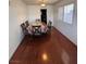 Dining room featuring wood floors, natural light and seating for six at 4466 Palm Grove Dr, Las Vegas, NV 89120