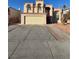 Inviting two-story home with a spacious driveway and attached two-car garage at 4466 Palm Grove Dr, Las Vegas, NV 89120
