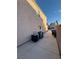 The exterior of the property features central air conditioning, utilities access, and a walled yard at 4466 Palm Grove Dr, Las Vegas, NV 89120