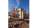 Charming two-story home featuring a stucco exterior, tiled roof, and desert landscaping at 4466 Palm Grove Dr, Las Vegas, NV 89120