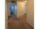Carpeted hallway showcasing access to multiple rooms, offering ease of movement at 4466 Palm Grove Dr, Las Vegas, NV 89120