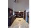 Spacious kitchen with dark cabinetry, granite countertops, and tiled floors at 4466 Palm Grove Dr, Las Vegas, NV 89120