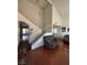 Bright living room featuring vaulted ceilings, wood floors, and a staircase at 4466 Palm Grove Dr, Las Vegas, NV 89120