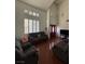 Bright living room featuring vaulted ceilings, wood floors, and multiple sofas at 4466 Palm Grove Dr, Las Vegas, NV 89120