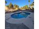 Sparkling pool with spa offers a relaxing backyard retreat, accented by lush greenery and comfortable seating at 4466 Palm Grove Dr, Las Vegas, NV 89120