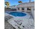 Backyard pool with patio, bench and lounge chairs for relaxation and entertainment on a sunny day at 4466 Palm Grove Dr, Las Vegas, NV 89120