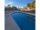 Relax and unwind by the pool with an attached spa surrounded by backyard greenery at 4466 Palm Grove Dr, Las Vegas, NV 89120