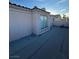 View of the roof of the property with textured surfaces and a sliding glass door at 4466 Palm Grove Dr, Las Vegas, NV 89120