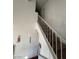 Carpeted staircase with white railing in a well-lit home at 4466 Palm Grove Dr, Las Vegas, NV 89120