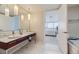 Modern bathroom with double vanity and a view into the bedroom at 4471 Dean Martin Dr # 1002, Las Vegas, NV 89103