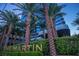 The Martin building with palm trees and landscaping at 4471 Dean Martin Dr # 1002, Las Vegas, NV 89103