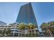 High-rise building with palm trees and parking at 4471 Dean Martin Dr # 1002, Las Vegas, NV 89103