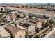 Aerial view of houses with solar panels and desert landscape at 4937 Caprock Canyon Ave, Las Vegas, NV 89139