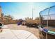 Gathering-friendly backyard with a trampoline and playset at 4937 Caprock Canyon Ave, Las Vegas, NV 89139