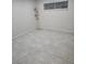 Simple bedroom with tile floors and a floor lamp at 5100 Pebble Beach Blvd, Las Vegas, NV 89108