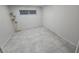 Simple bedroom with tile floors and a floor lamp at 5100 Pebble Beach Blvd, Las Vegas, NV 89108