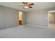 Spacious bedroom with ceiling fan and en-suite bathroom access at 5684 Bishop Flowers St, Las Vegas, NV 89130