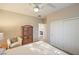 Bedroom with sliding door closet and wooden armoire at 6112 Canter Glen Ave, Las Vegas, NV 89122