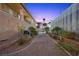 Exterior pathway with desert landscaping, stone pavers, and view of the building at 731 N Parawan St, Henderson, NV 89015