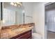 Bathroom with granite vanity and updated fixtures at 7755 Coley Ave, Las Vegas, NV 89117