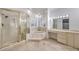 Elegant bathroom with a shower, soaking tub, and double vanity at 7755 Coley Ave, Las Vegas, NV 89117