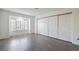 Bright bedroom with large closet and wood-look floors at 7755 Coley Ave, Las Vegas, NV 89117
